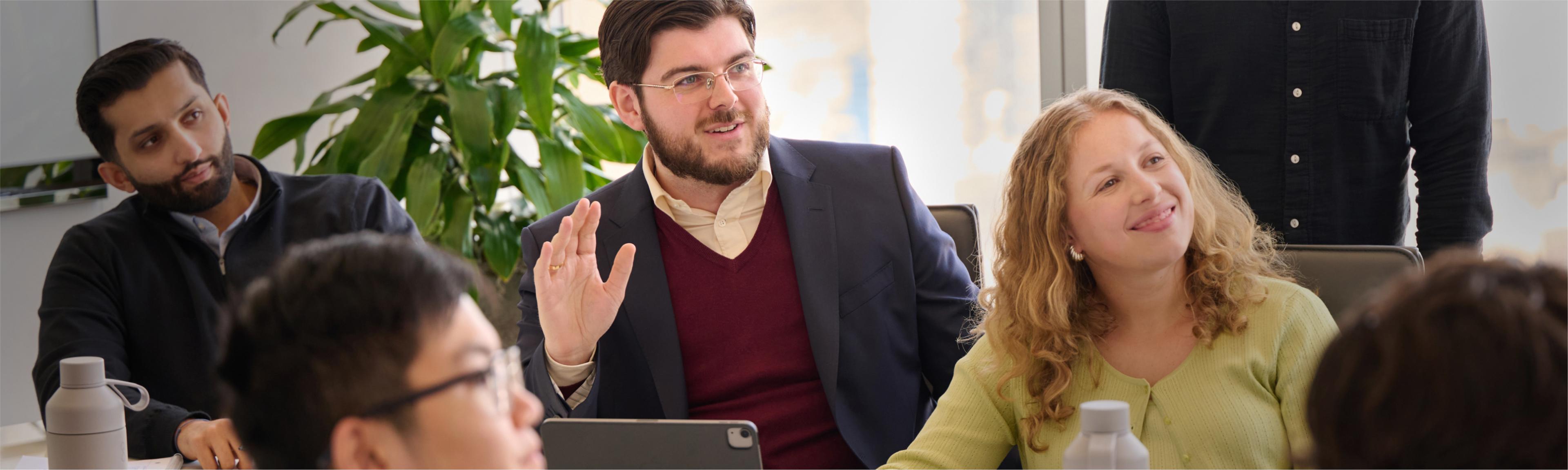 Employees casually talking to each other in the office