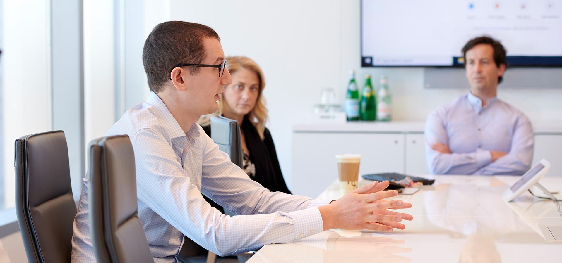Employees having a meeting in a meeting room